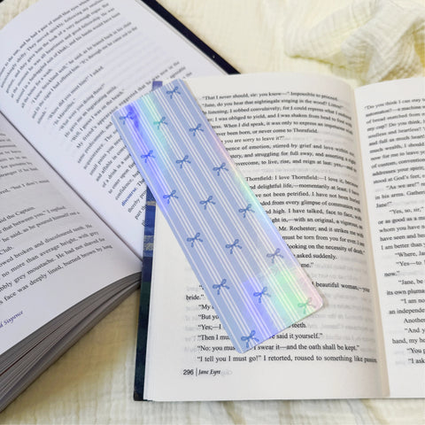 Blue bow stripe bookmark displayed on an open book page
