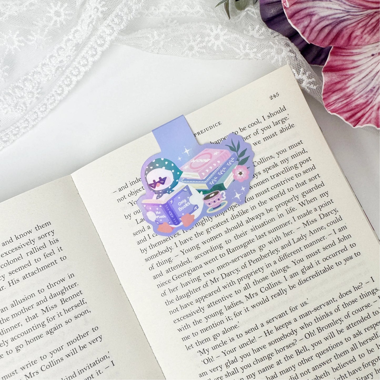 Bookish duck magnetic bookmark clipped onto an open book page