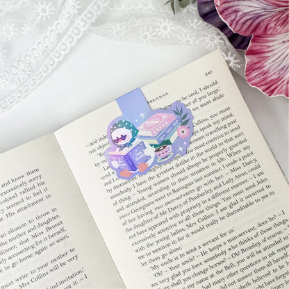 Bookish duck magnetic bookmark clipped onto an open book page