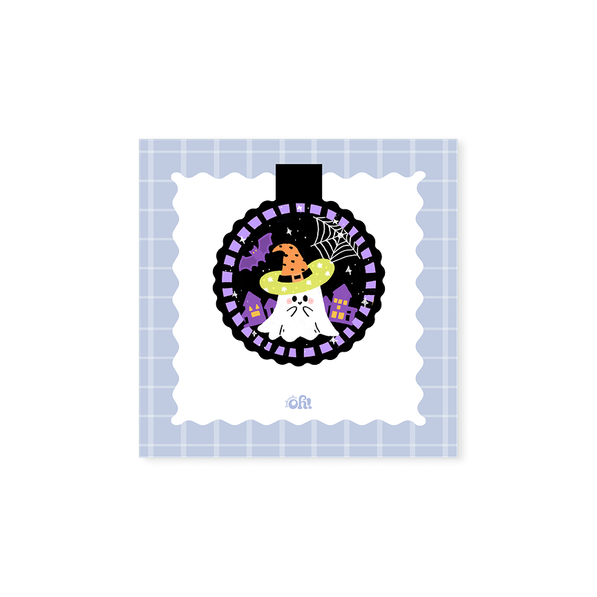 Witch Hat Ghost holographic magnetic bookmark with a white ghost, orange witch hat, spiderweb, bat and purple houses