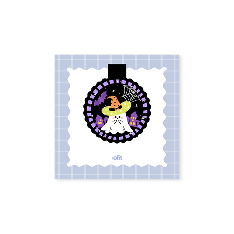 Witch Hat Ghost holographic magnetic bookmark with a white ghost, orange witch hat, spiderweb, bat and purple houses