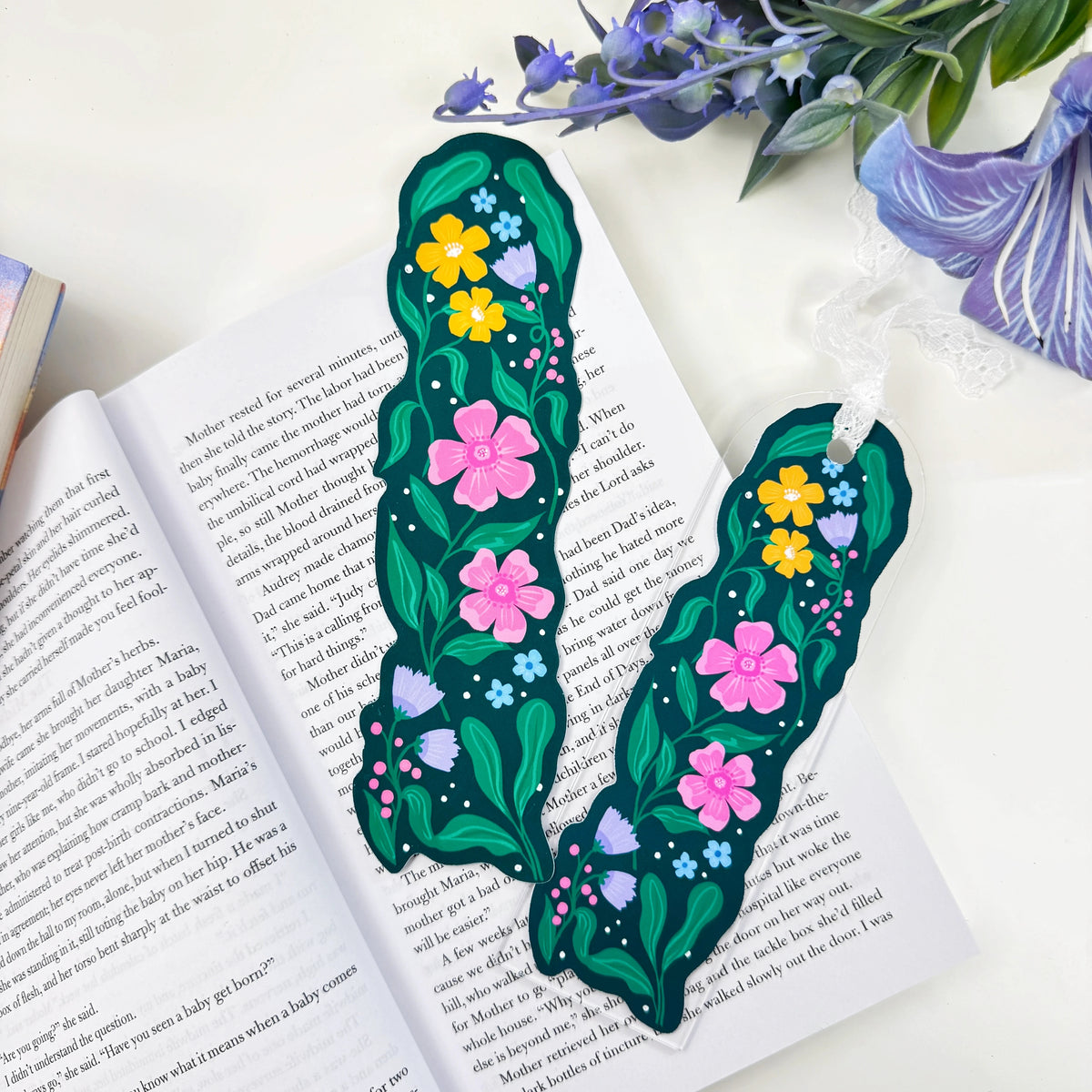 Two Garden in Bloom floral bookmarks displayed on an open book