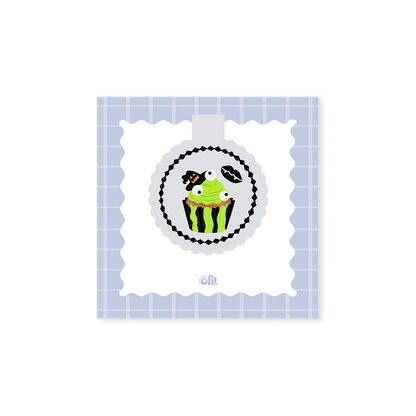 Monster Cupcake holographic magnetic bookmark with green frosting, candy eyeballs, a witch hat and spooky lips