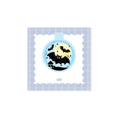 Full Moon Bat holographic magnetic bookmark with black bats flying over a haunted house against a yellow moon