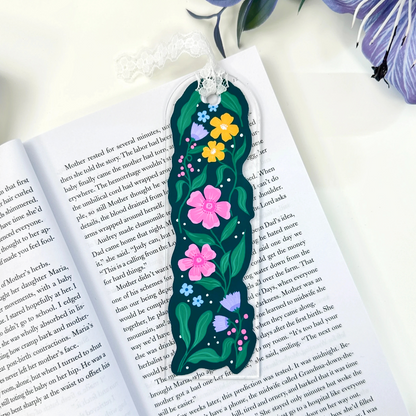 Garden in Bloom clear acrylic bookmark with colorful floral design and white lace tie on an open book