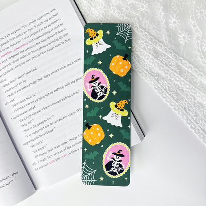 Trick or Read Halloween classic bookmark with ghosts, pumpkins and skeletons on dark green