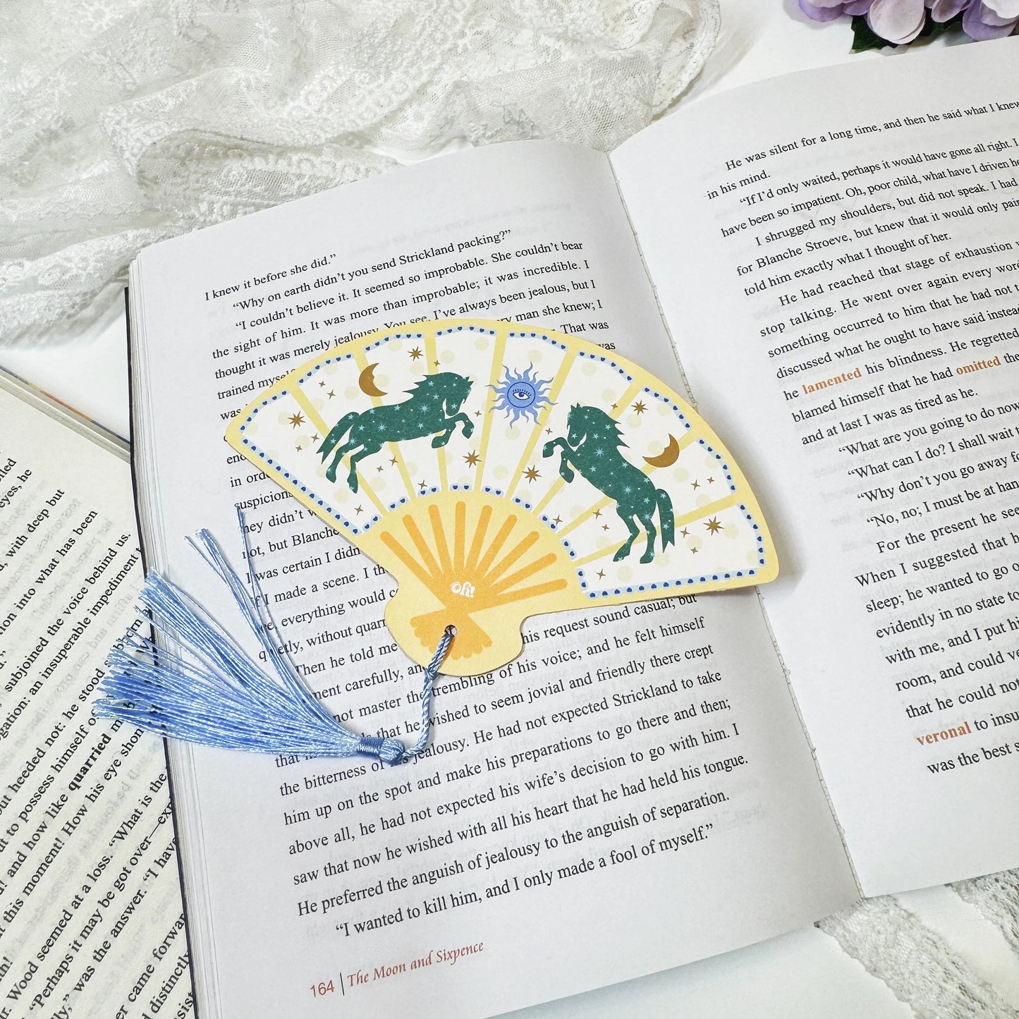 Dark green horse fan tassel bookmark displayed with tassel detail