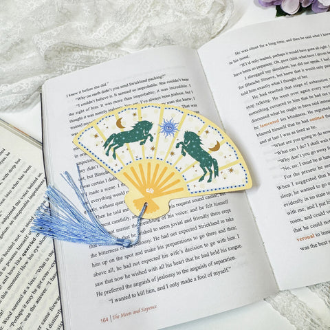 Dark green horse fan tassel bookmark displayed with tassel detail