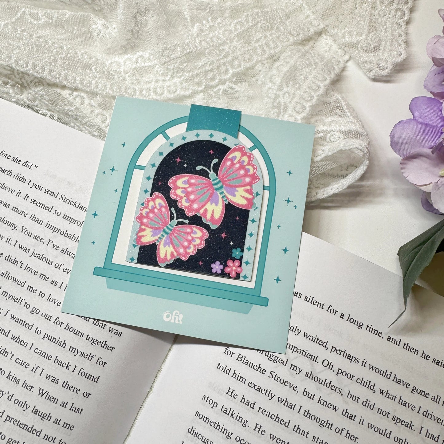 Dark night butterfly magnetic bookmark displayed on an open book