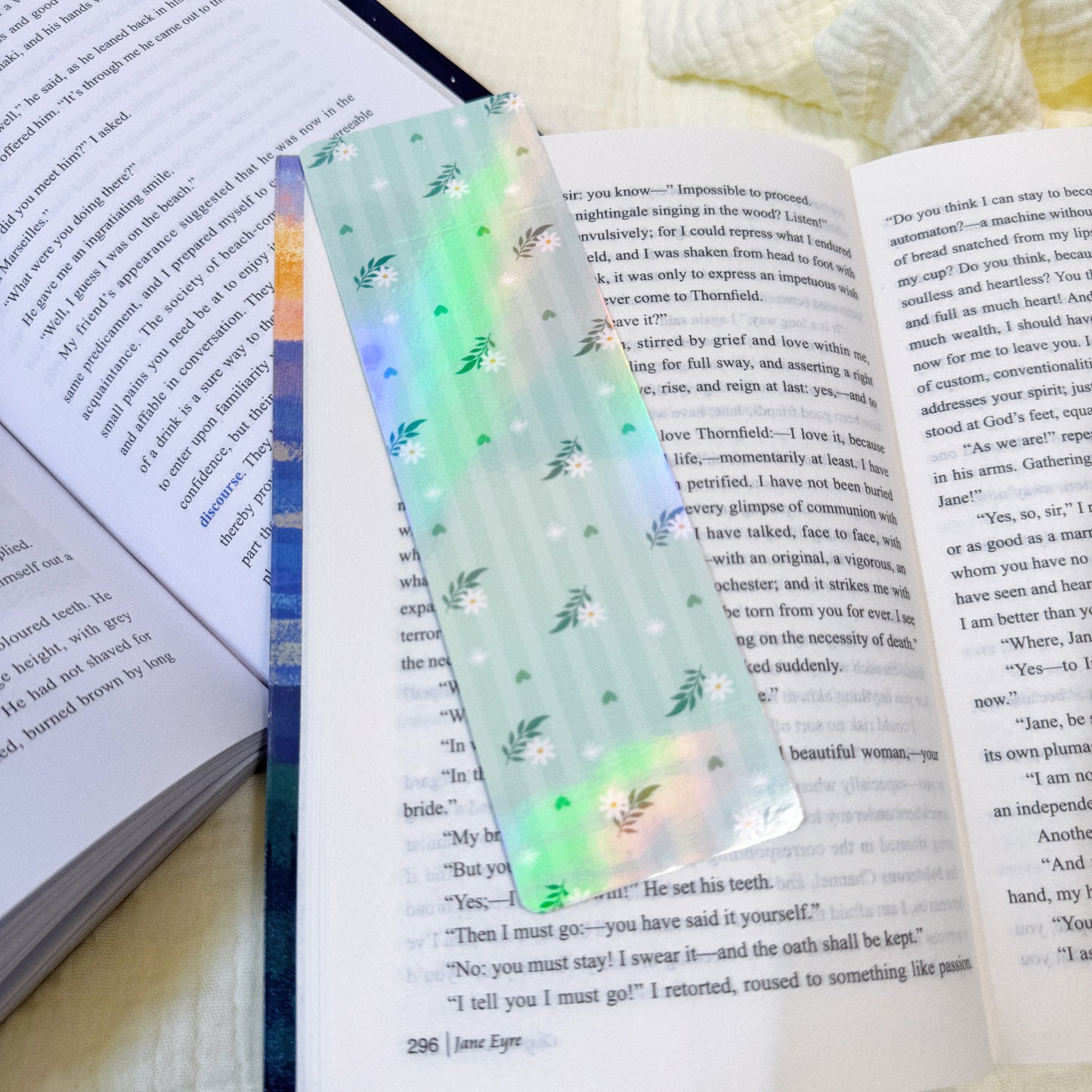 Green mint stripe bookmark displayed on an open book page