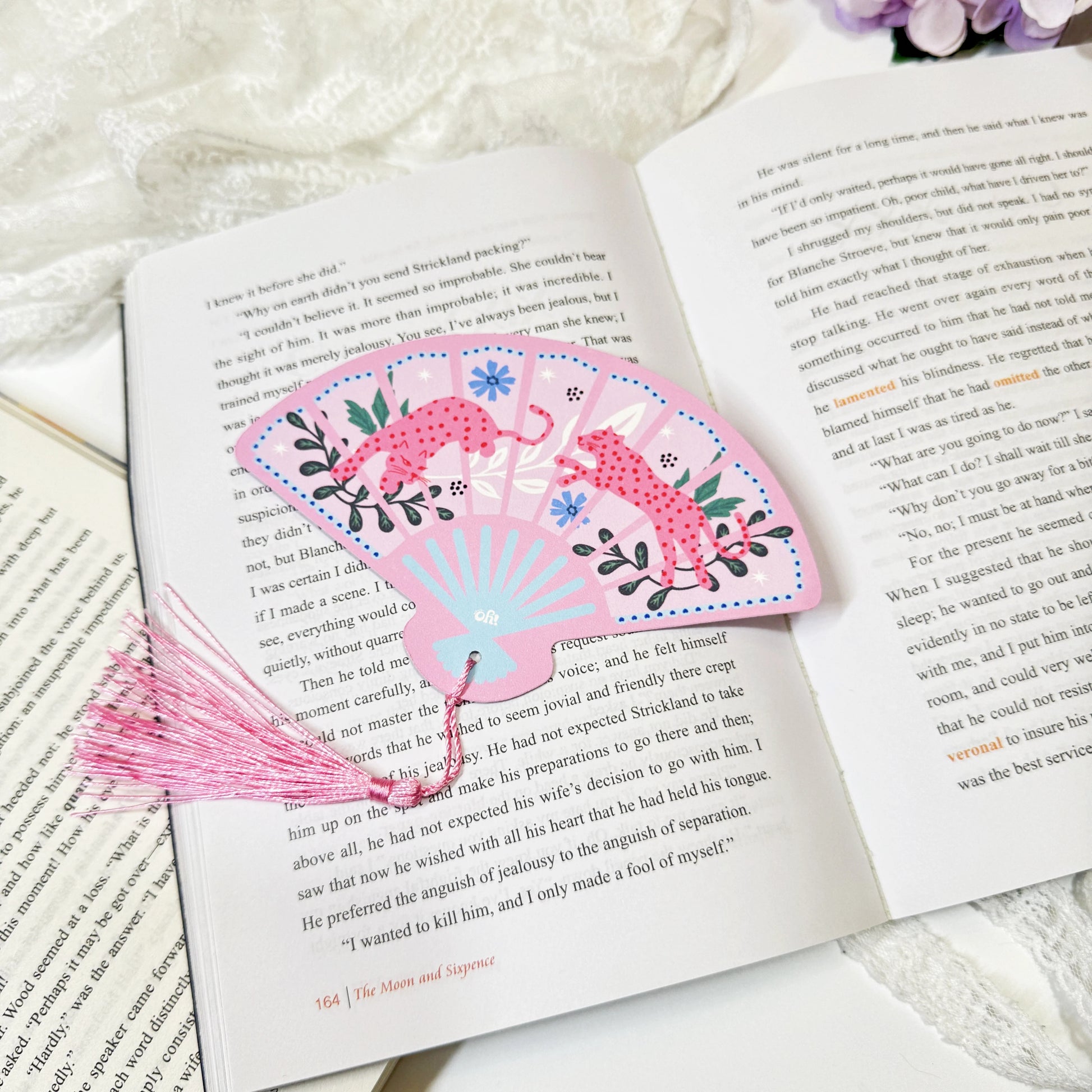 Pink leopard fan tassel bookmark displayed with tassel detail