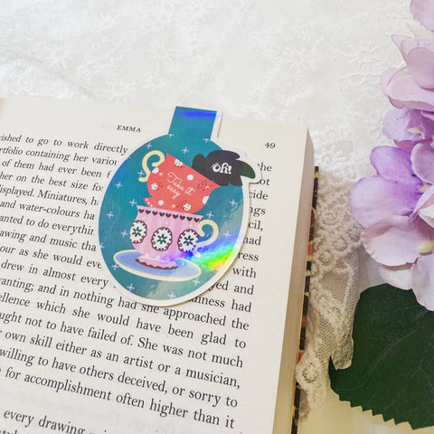 Oh Take It Easy teacup magnetic bookmark displayed on an open book