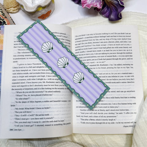 Purple shell stripe classic bookmark displayed on an open book page