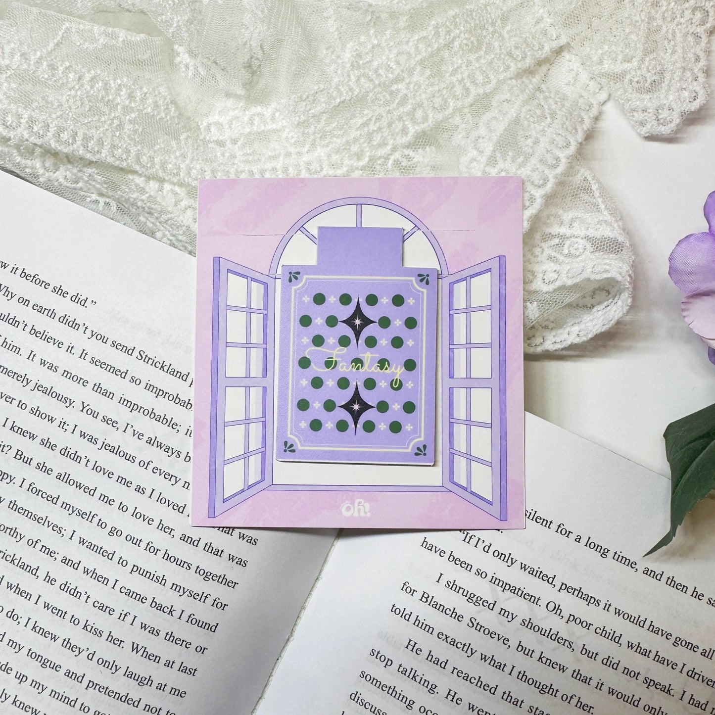 Purple magic book magnetic bookmark clipped on a book page