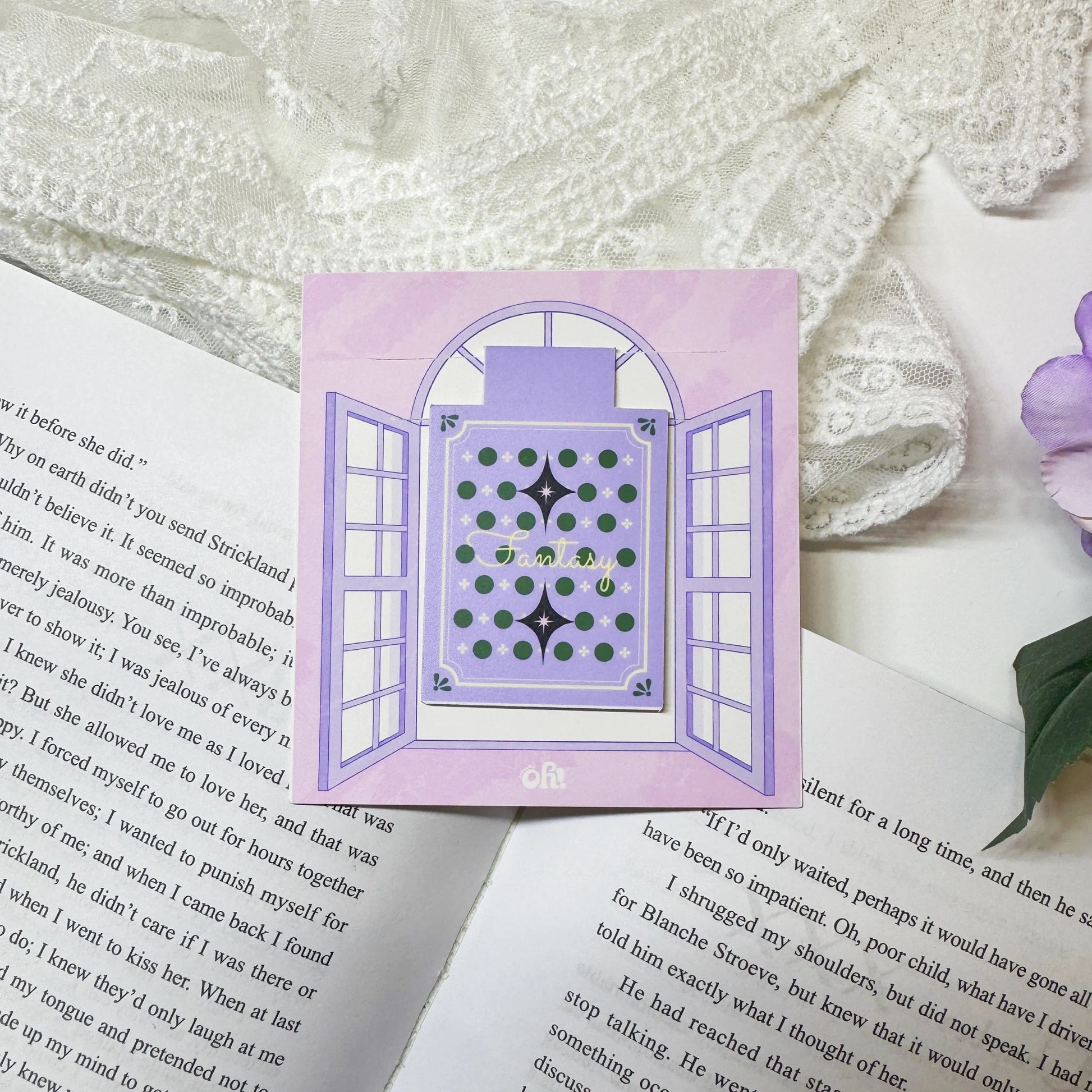 Purple magic book magnetic bookmark clipped on a book page