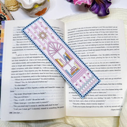 Pink book stack classic bookmark displayed on an open book page