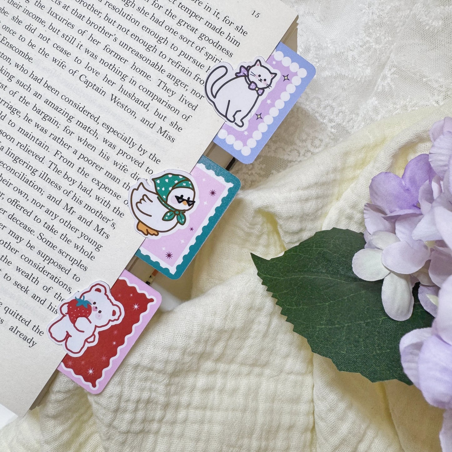 Cute animal page clip bookmarks attached to book pages