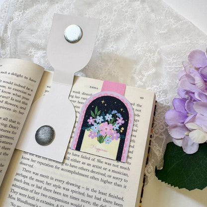 Magnetic bookmark clipped onto an open book page