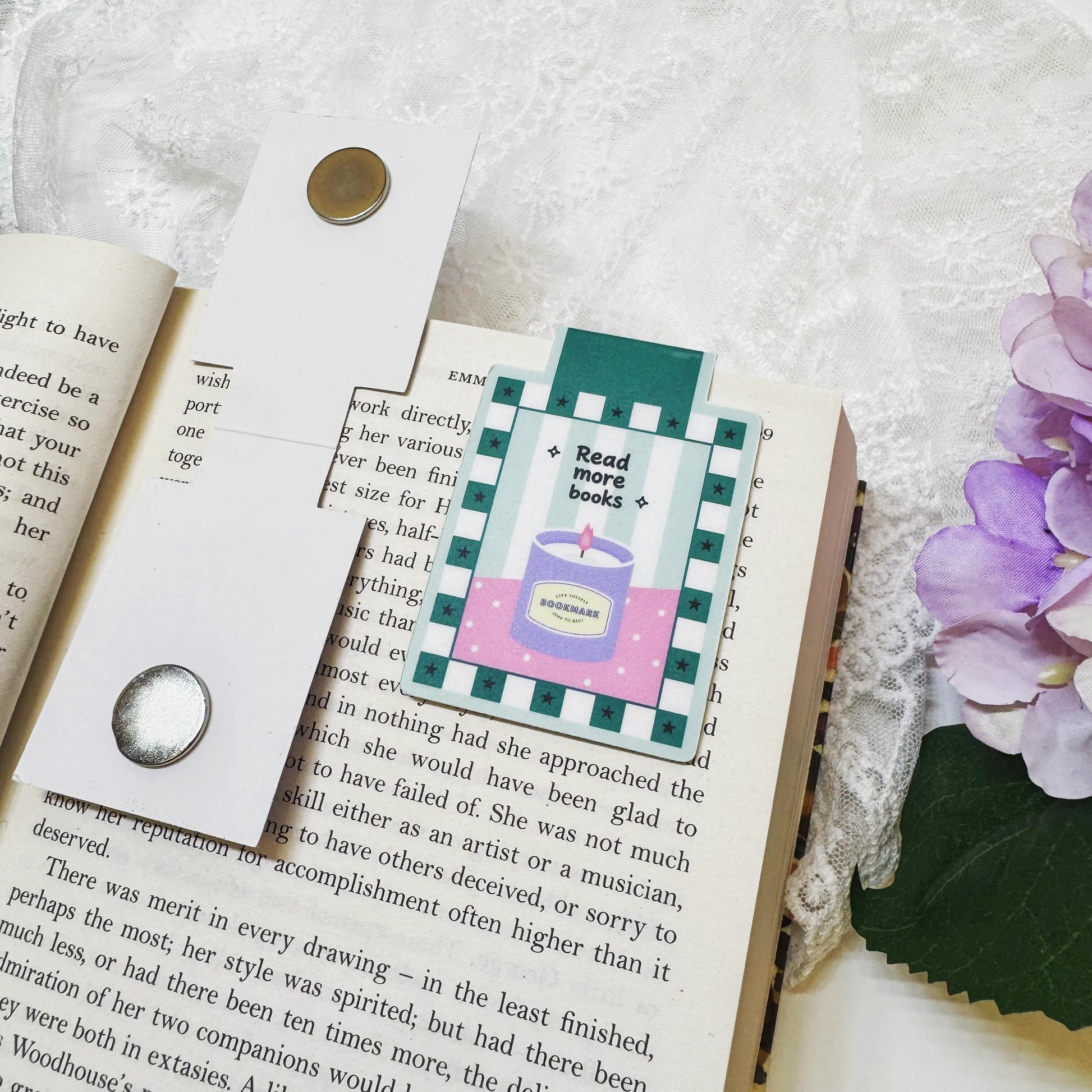 Magnetic bookmark clipped onto an open book page