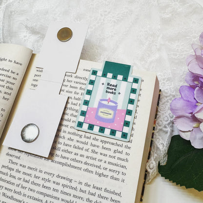 Magnetic bookmark clipped onto an open book page